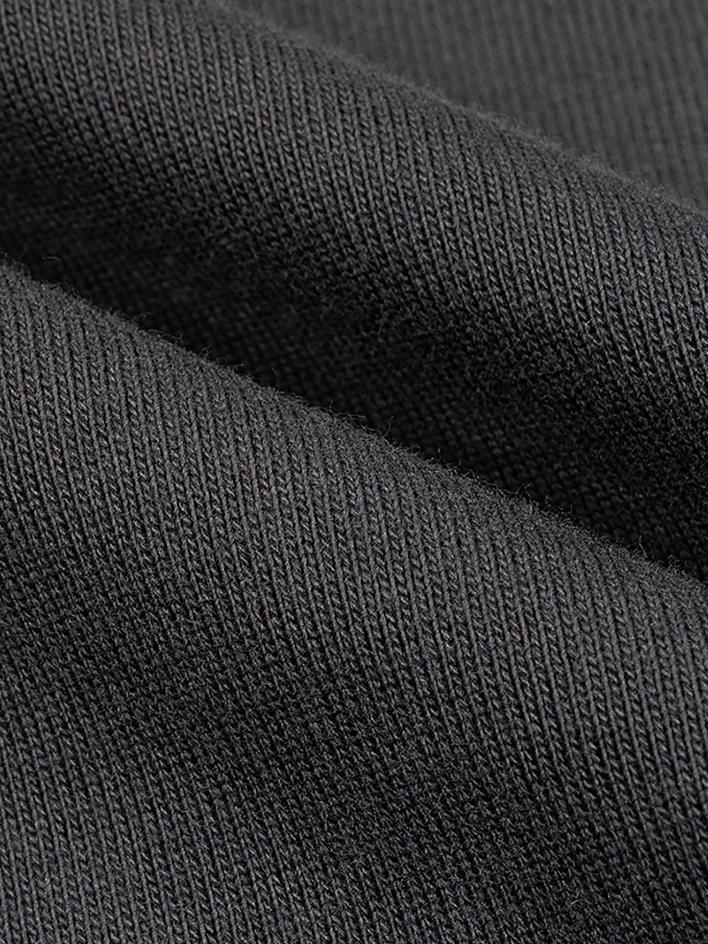 INVINCIBLE: COMPENDIUM 'LIMITED' RAW EDGE BOXY MUSCLE TEE IN BLACK